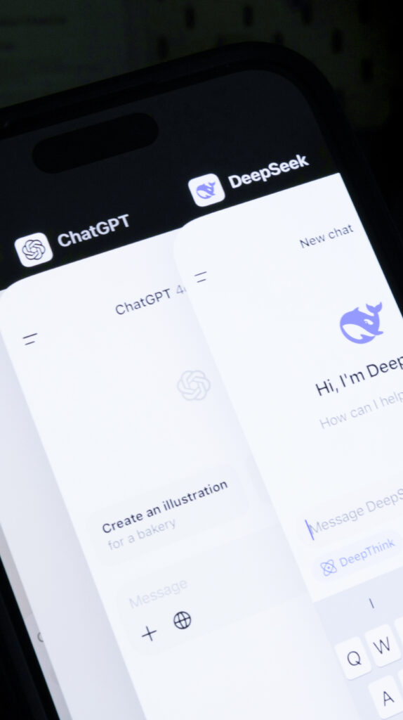 Smartphone displaying ChatGPT and Deepseek app interfaces side by side